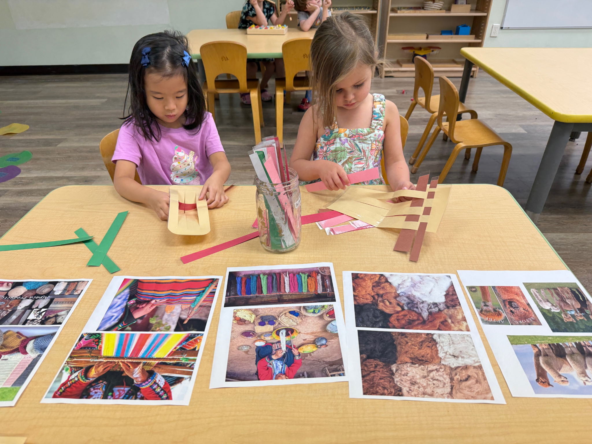 Preschoolers working with Montessori materials and picture cards